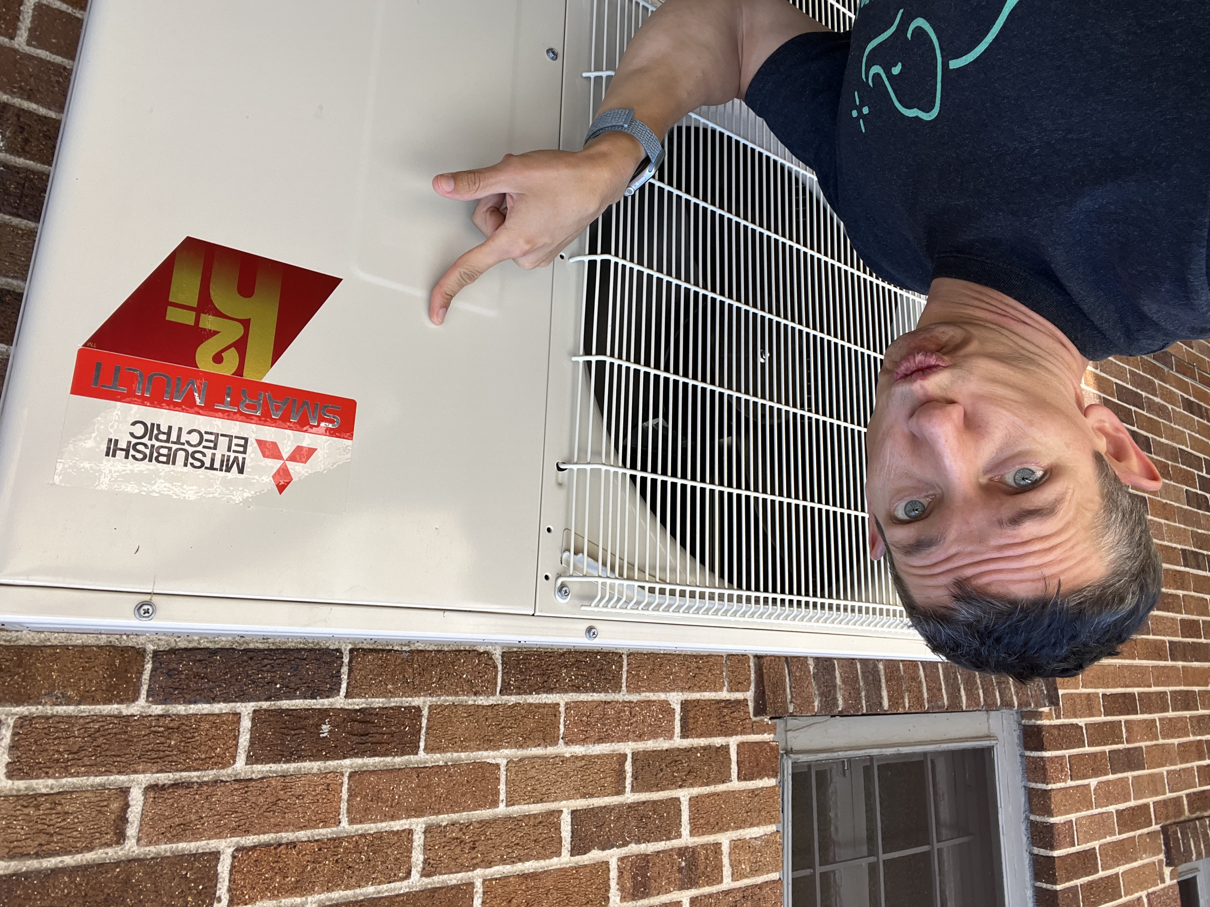 Josh Lake with Mitsubishi hyper-heating heat pump installed by Elephant Energy