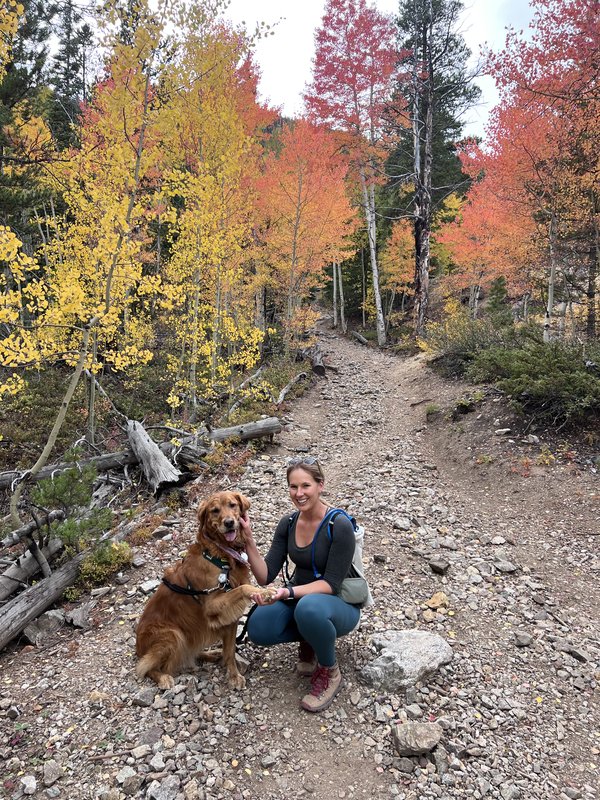Rachael and Scout on a fall trail